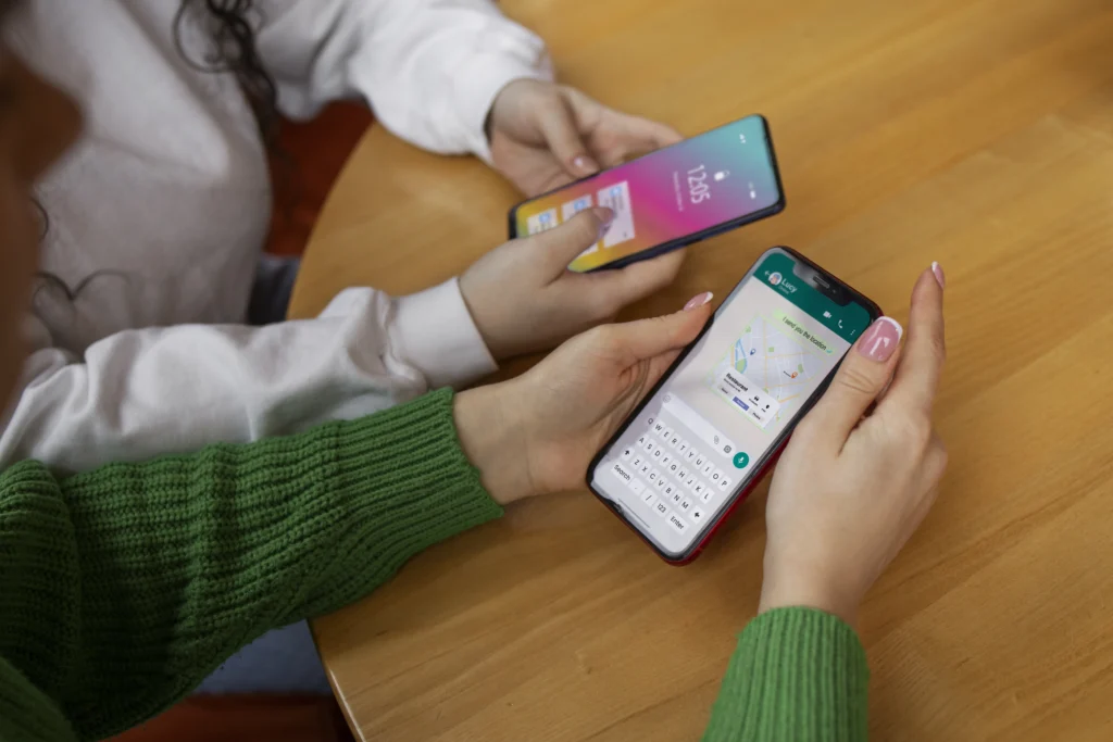 A smartphone showing WhatsApp with an AI chatbot icon and a judge’s gavel, representing regulatory scrutiny.